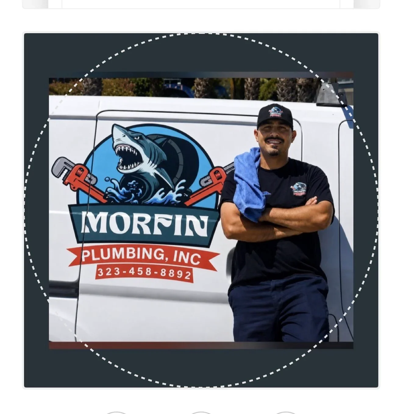 White service van with custom shark logo and plumbing company branding wrap